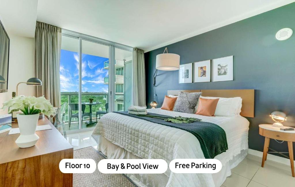 a bedroom with a bed and a balcony at MVR-Sunset Luxury You Can-t Find Anywhere Else in Miami