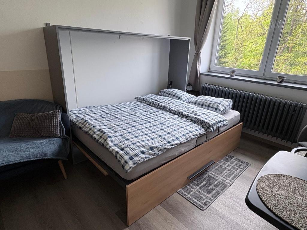 Postel nebo postele na pokoji v ubytování Apartmány IMLADRIS, Hotel u pralesa