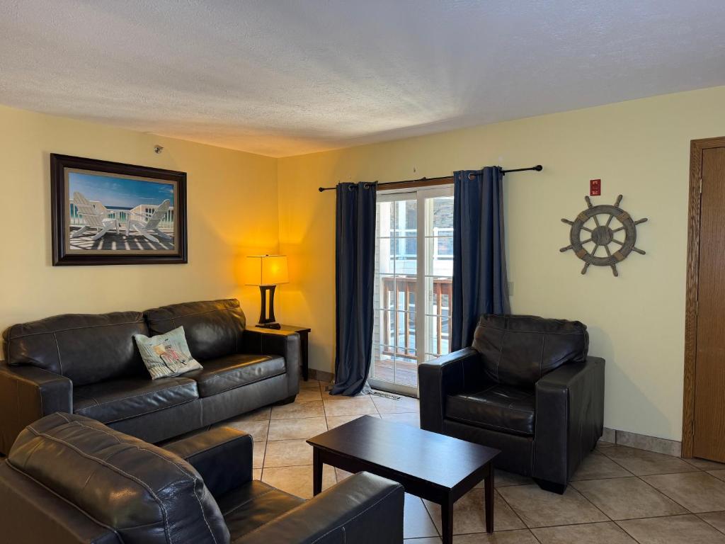 a living room with a couch and chairs and a table at Put-in-Bay Poolview Condo #5 in Put-in-Bay