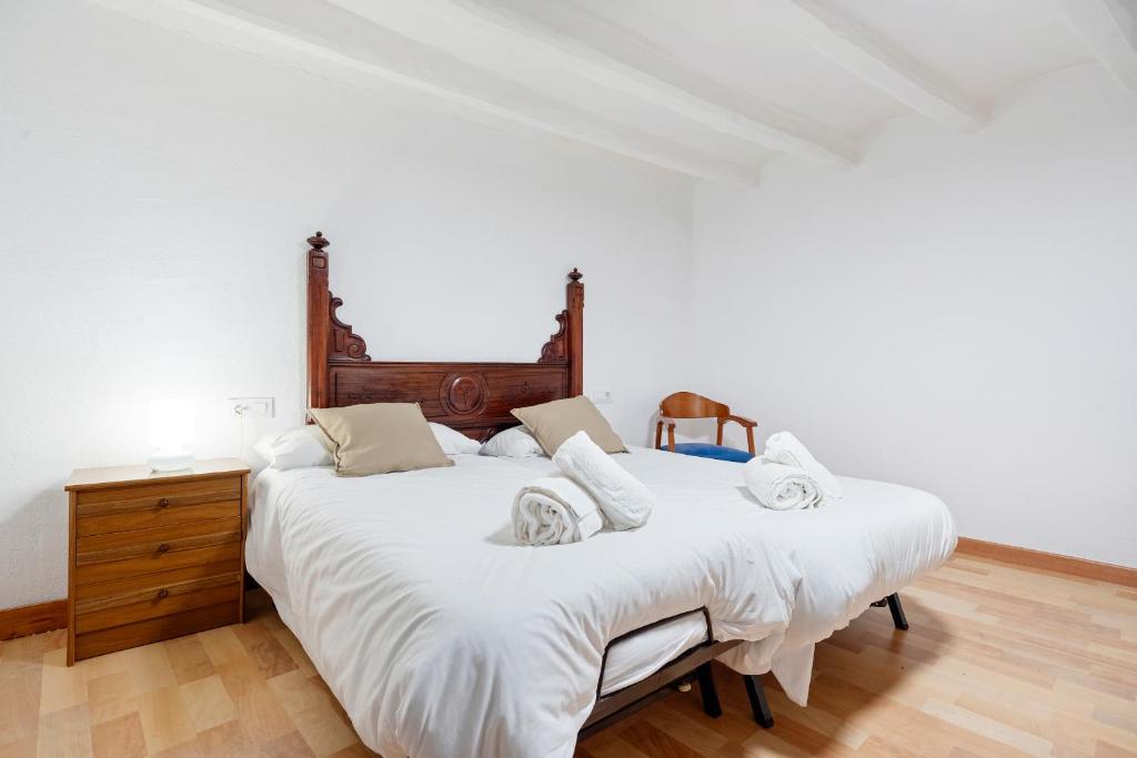 Postel nebo postele na pokoji v ubytování Hauzify I Casa Rourell