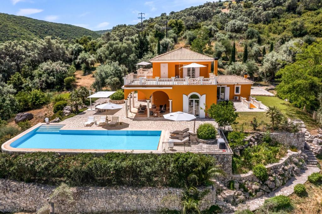 an aerial view of a villa with a swimming pool at Kronos Estate Lefkada - 5 star luxury in Mikros Gialos