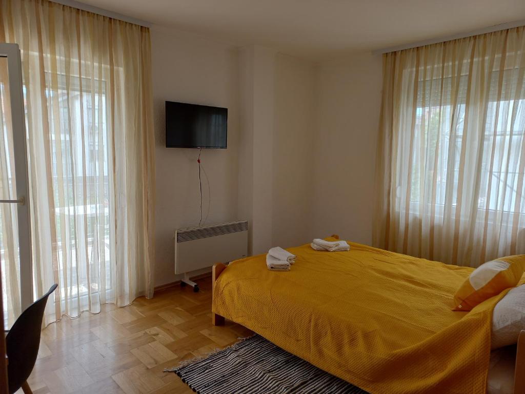 Postel nebo postele na pokoji v ubytování Villa Afrodita