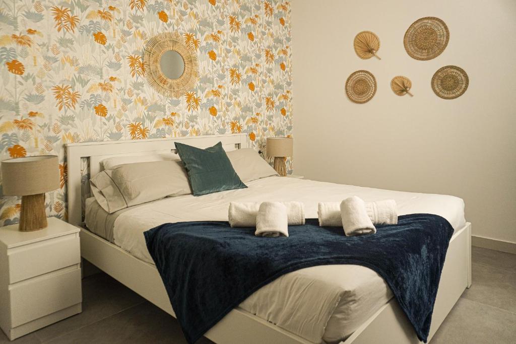 En eller flere senge i et værelse på Playa San Juan Costa Relax