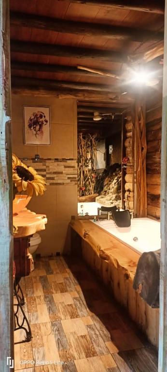 a bathroom with a bath tub in a room at Cabaña en La Calera con Jacuzzi in La Calera