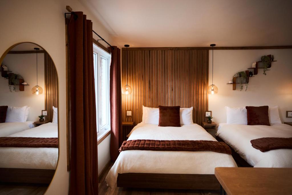 Voodi või voodid majutusasutuse Motel Boutique Hygge toas