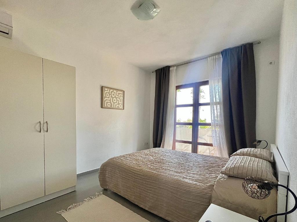 Postel nebo postele na pokoji v ubytování Green Villa in Olives