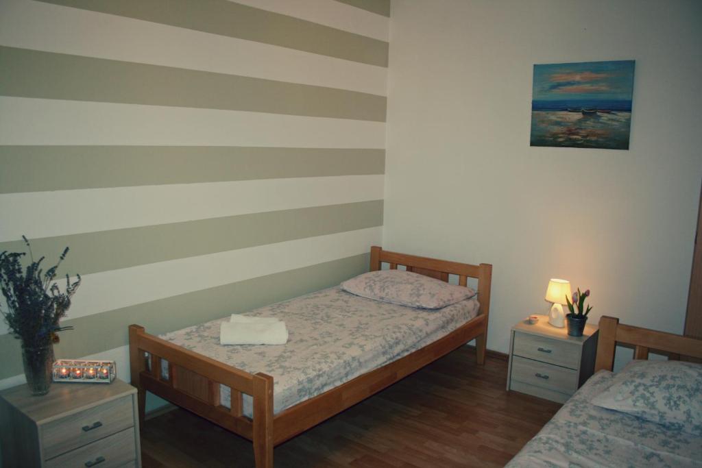 Posteľ alebo postele v izbe v ubytovaní Apartments Jakšić