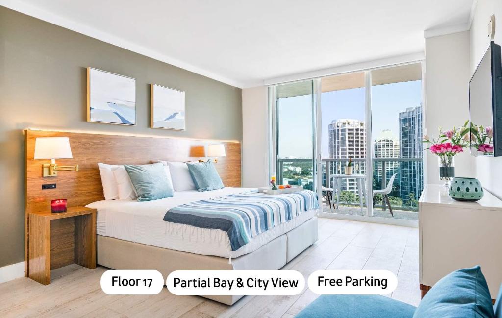 a bedroom with a bed and a large window at MVR - The Best of Work Relaxation in One in Miami