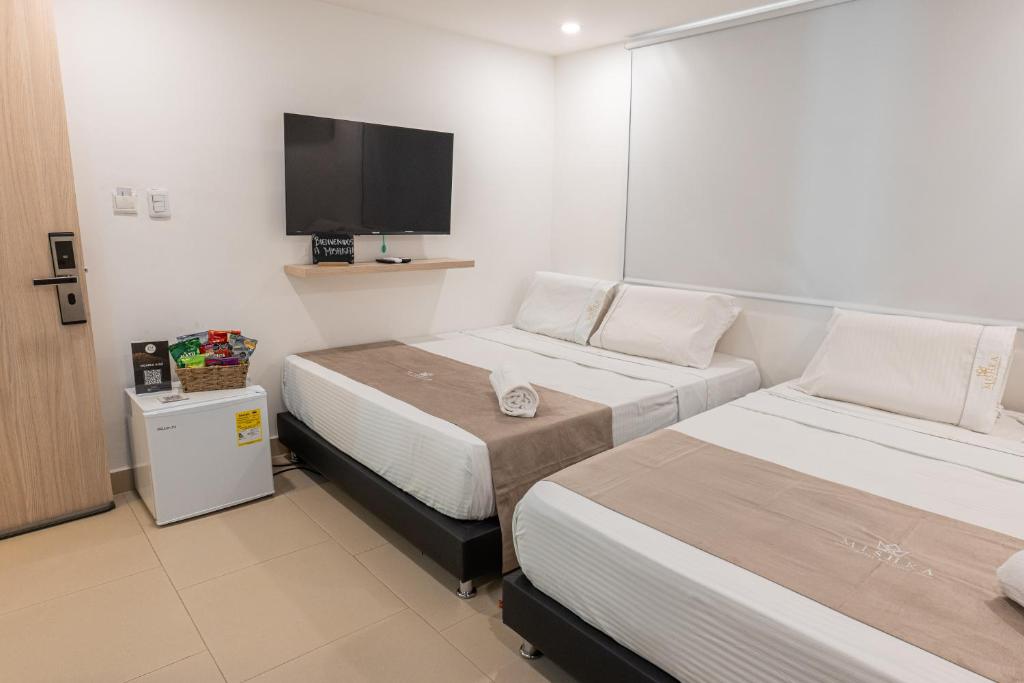 Postel nebo postele na pokoji v ubytování Mishka Hotel Boutique Habitación 102