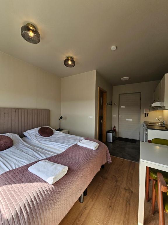 Postel nebo postele na pokoji v ubytování Borg Apartments