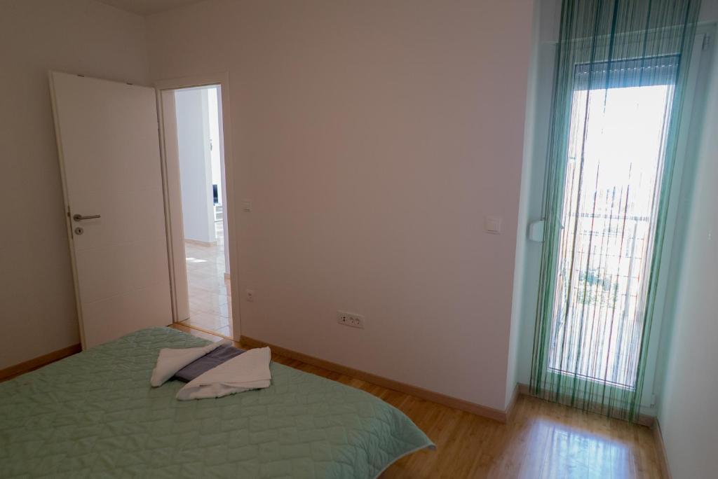 Postel nebo postele na pokoji v ubytování Apartmani Ružica