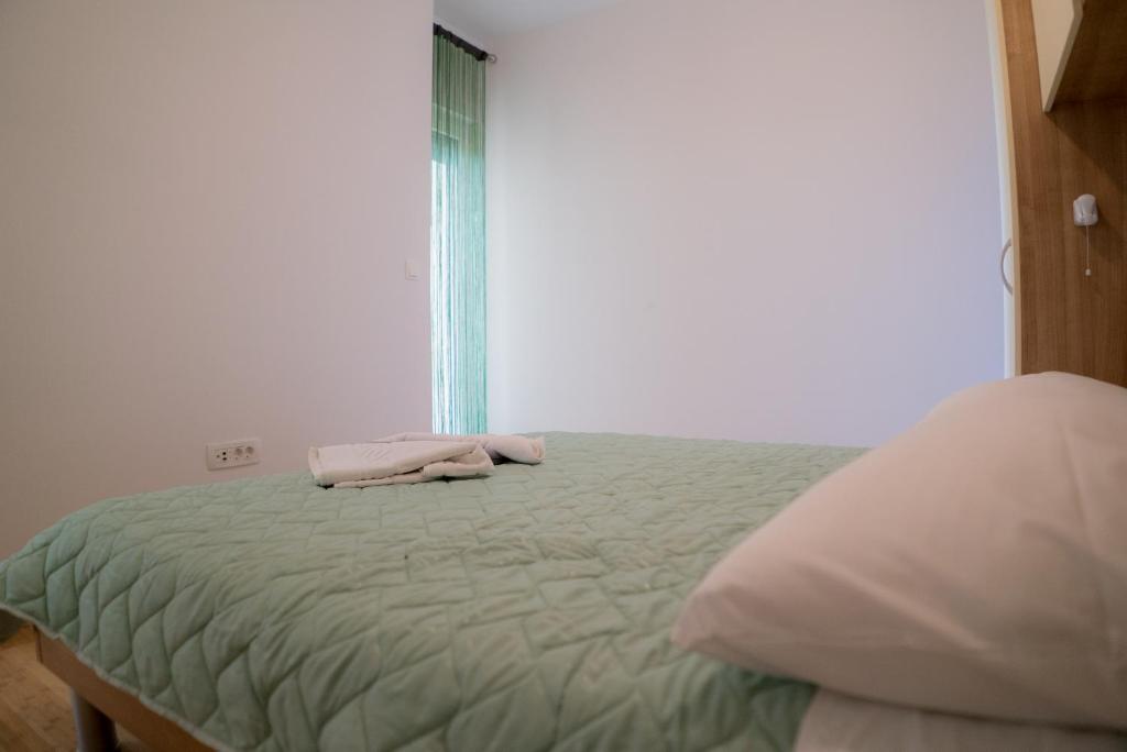 Postel nebo postele na pokoji v ubytování Apartmani Ružica
