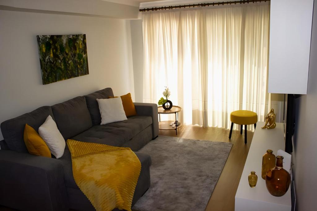 a living room with a couch and a table at DouroTerrace in Vila Nova de Gaia