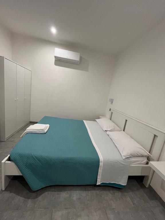 Postel nebo postele na pokoji v ubytování Dimora Dana