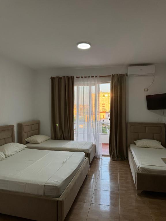 Postel nebo postele na pokoji v ubytování GuestHouse Cami