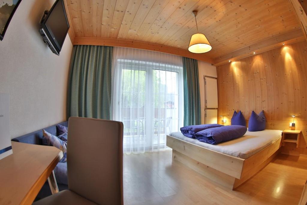 Postel nebo postele na pokoji v ubytování Hotel Stecher