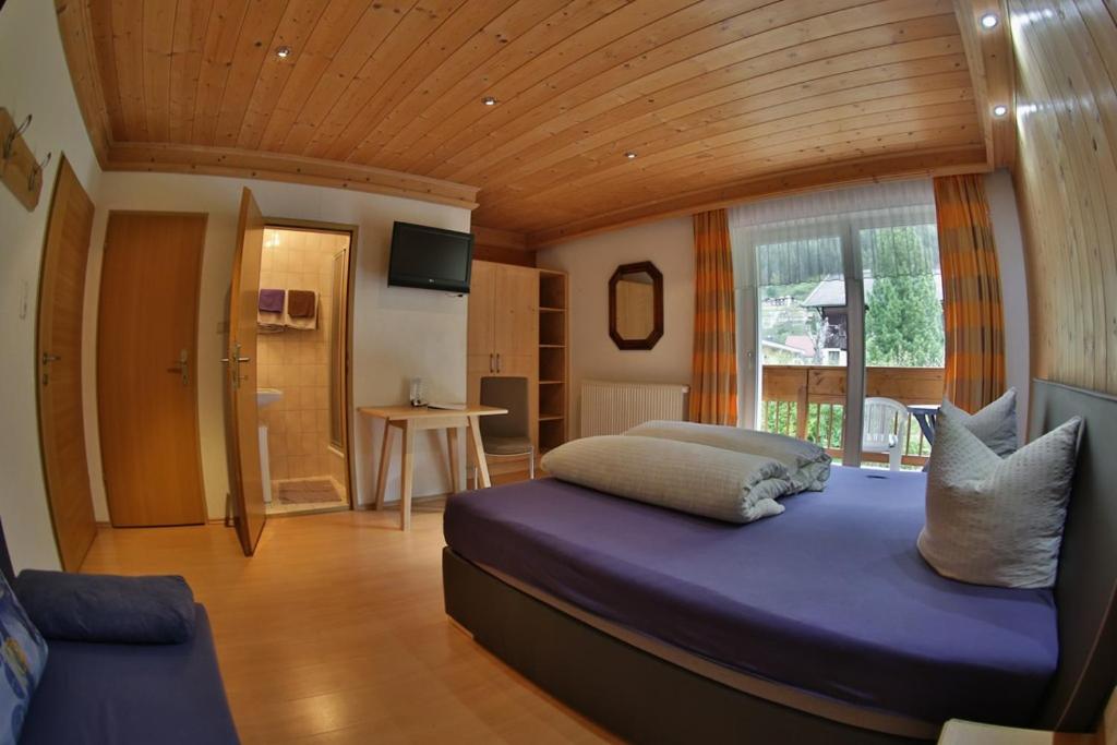 Postel nebo postele na pokoji v ubytování Hotel Stecher