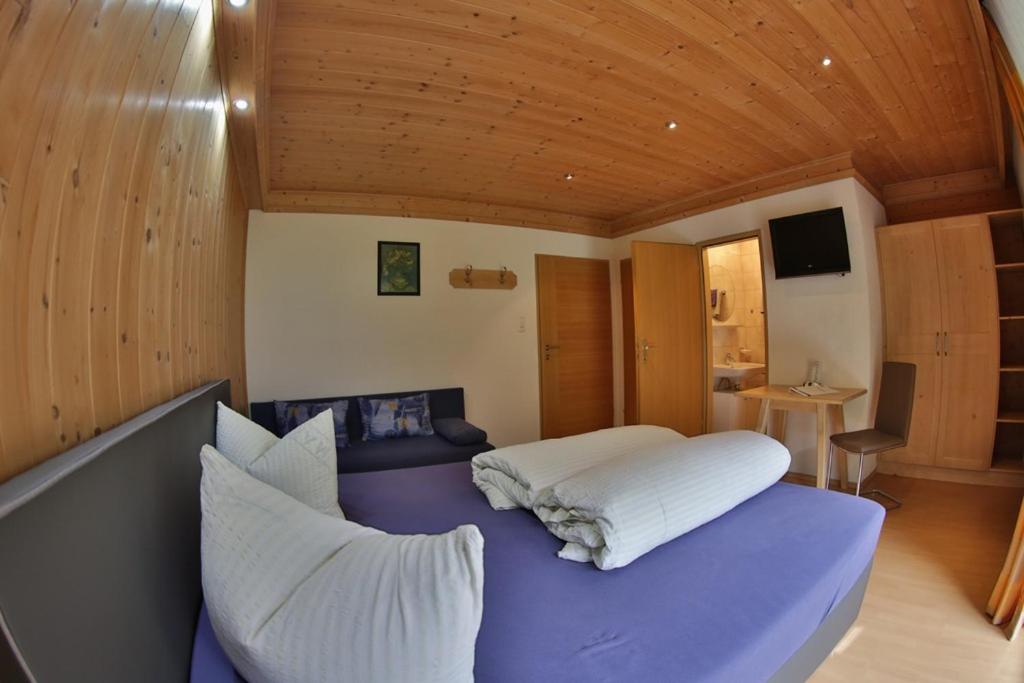 Postel nebo postele na pokoji v ubytování Hotel Stecher