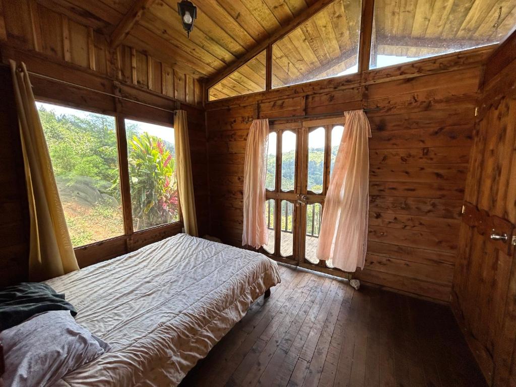 Postel nebo postele na pokoji v ubytování Cabañas la esperancita