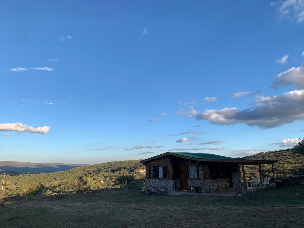 a small building on top of a hill at La Chuncana in La Falda