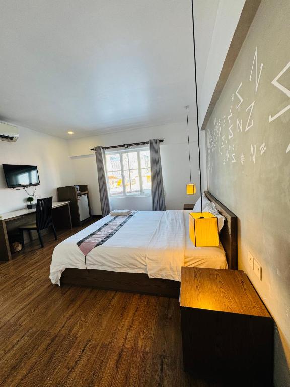 Postel nebo postele na pokoji v ubytování Asiban Quay Boutique Hotel