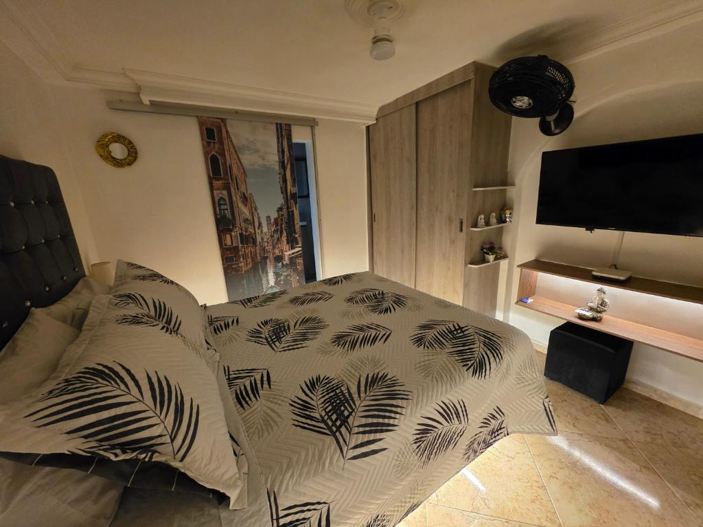 Ένα ή περισσότερα κρεβάτια σε δωμάτιο στο Studio cerca a estacion metro poblado