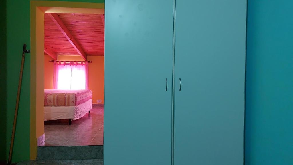 En eller flere senge i et værelse på Casa Painanbi