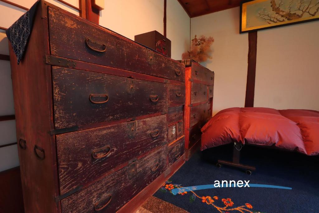 Postel nebo postele na pokoji v ubytování もりのもむ Morinomomu Guest House in Mitsuo