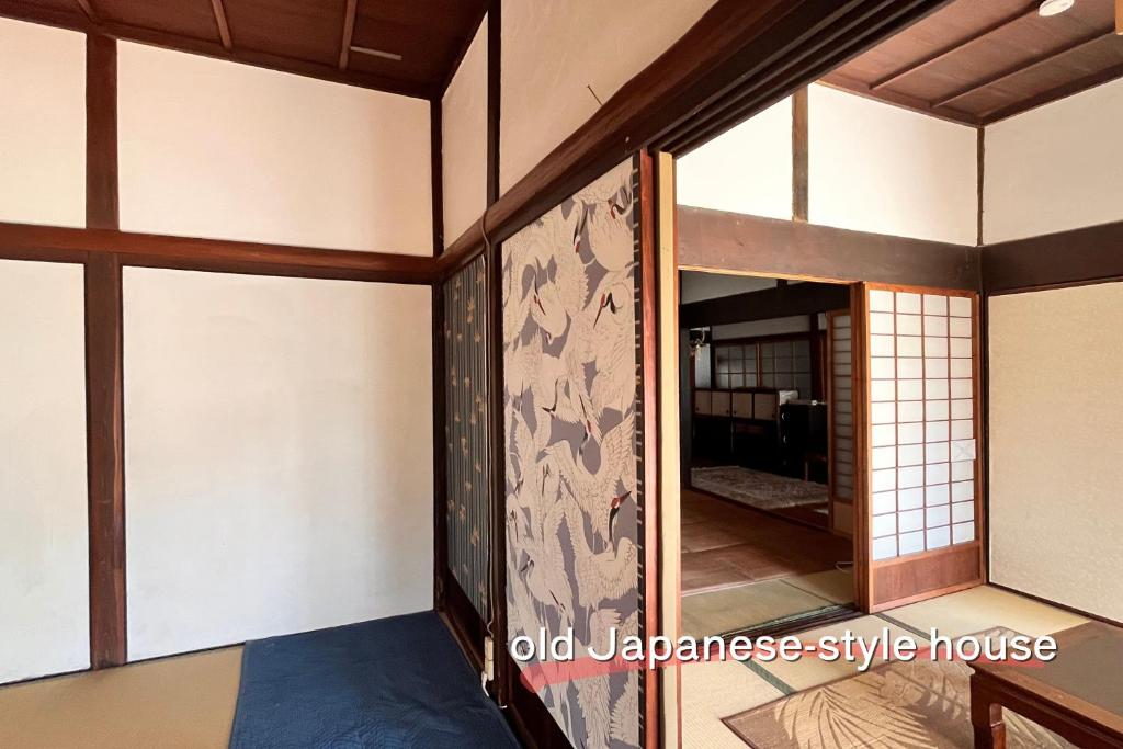 Postel nebo postele na pokoji v ubytování もりのもむ Morinomomu Guest House in Mitsuo