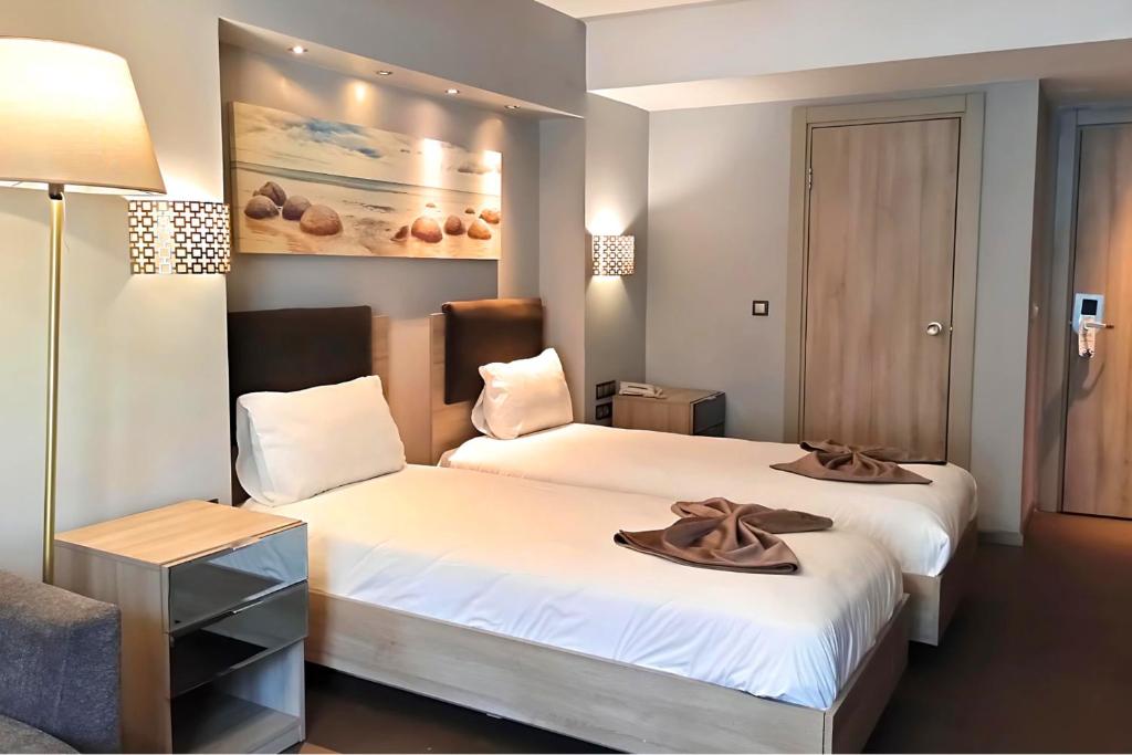 A bed or beds in a room at BC Residence Pangaldi