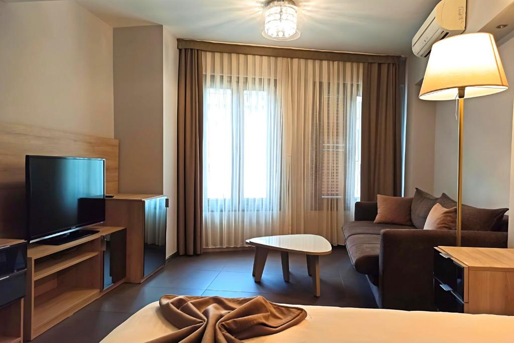 A television and/or entertainment centre at BC Residence Pangaldi