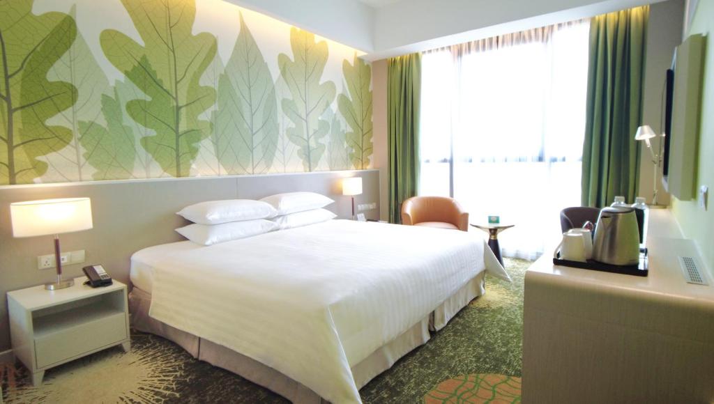 Postel nebo postele na pokoji v ubytování Sunway Velocity Hotel Kuala Lumpur