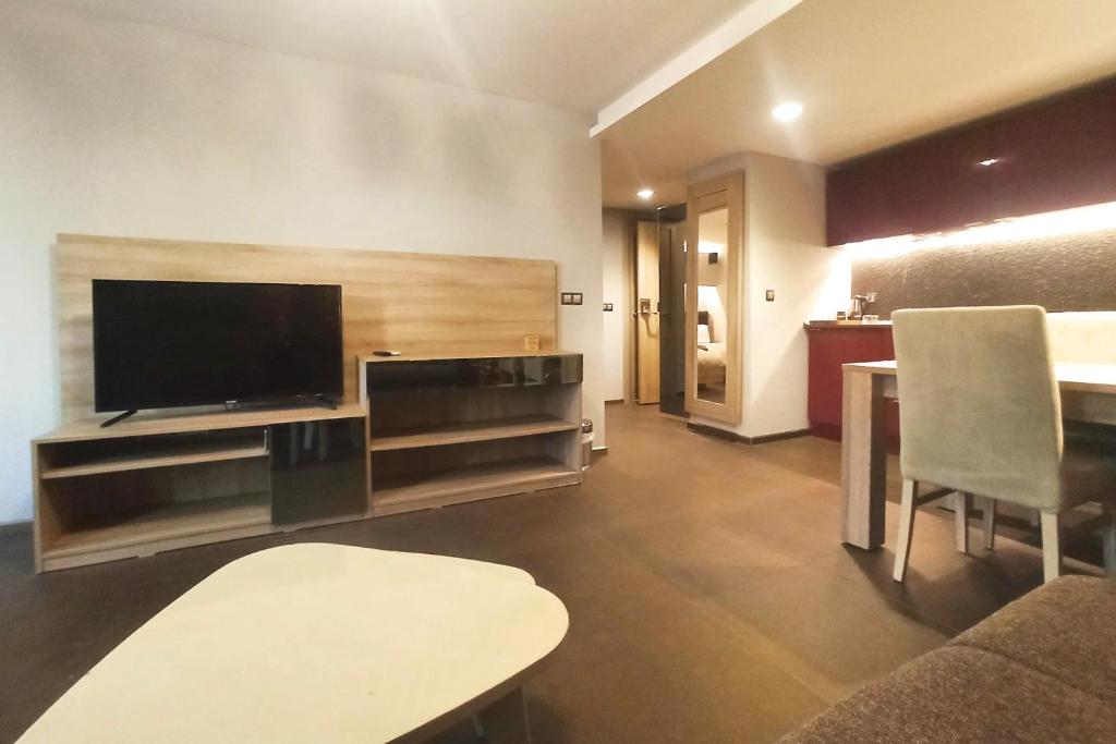 A television and/or entertainment centre at BC Residence Pangaldi