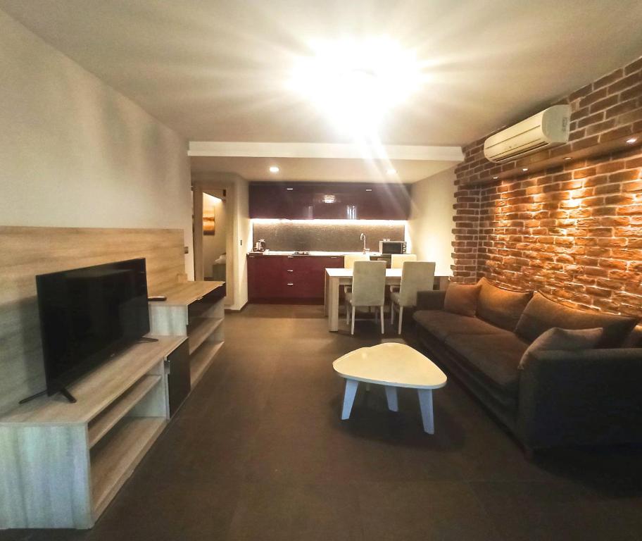 A television and/or entertainment centre at BC Residence Pangaldi