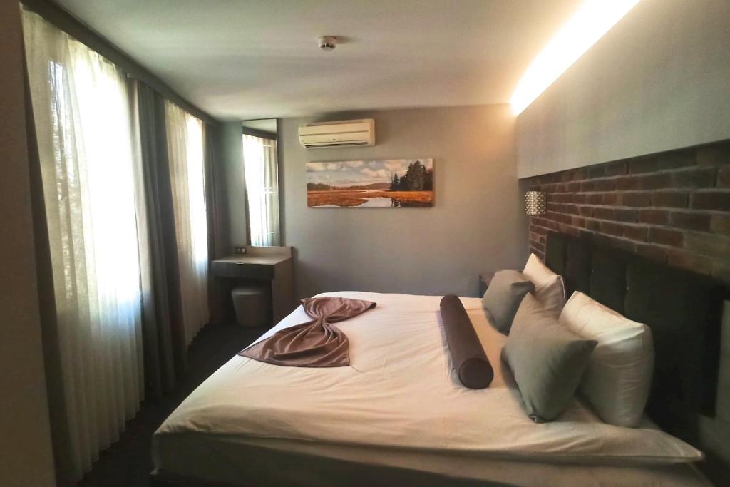 A bed or beds in a room at BC Residence Pangaldi