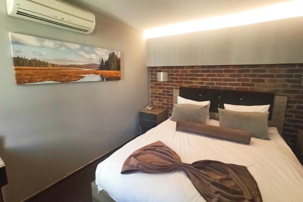 A bed or beds in a room at BC Residence Pangaldi