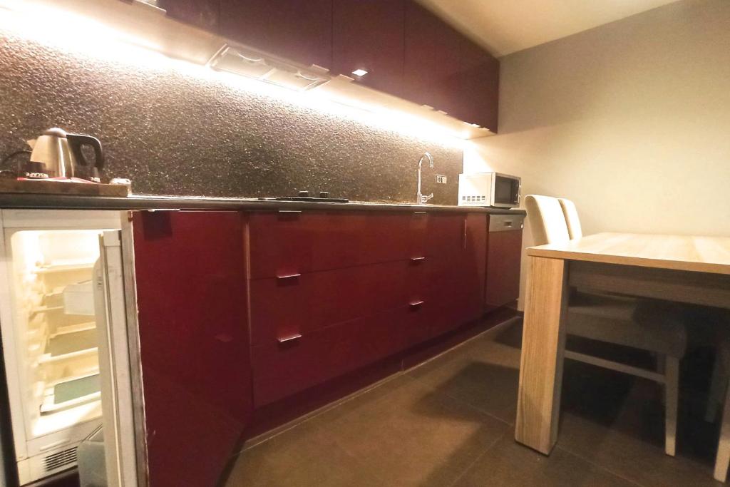 A kitchen or kitchenette at BC Residence Pangaldi