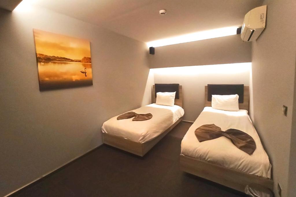 A bed or beds in a room at BC Residence Pangaldi