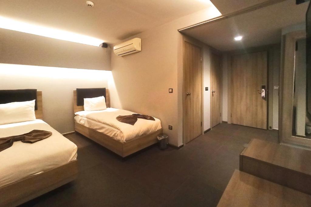 A bed or beds in a room at BC Residence Pangaldi