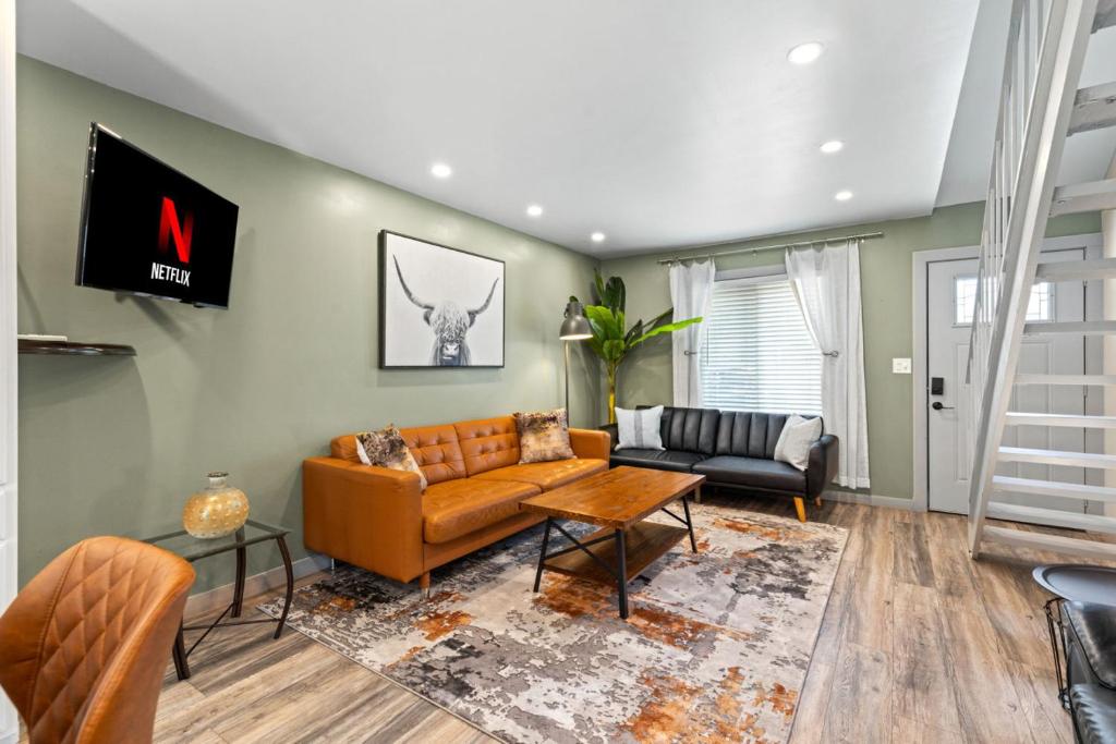 a living room with a couch and a table at Spectacular Austin SoCo Townhome in Austin