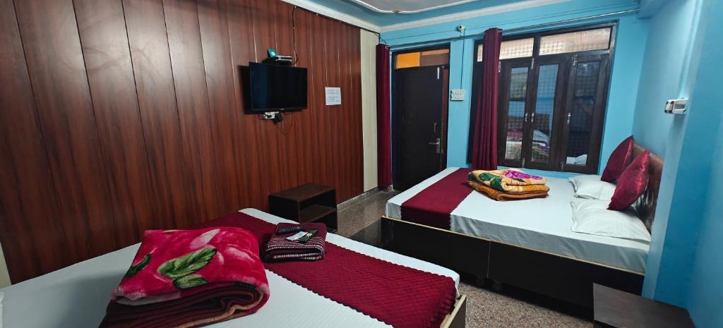Postel nebo postele na pokoji v ubytování Vasudev Retreat