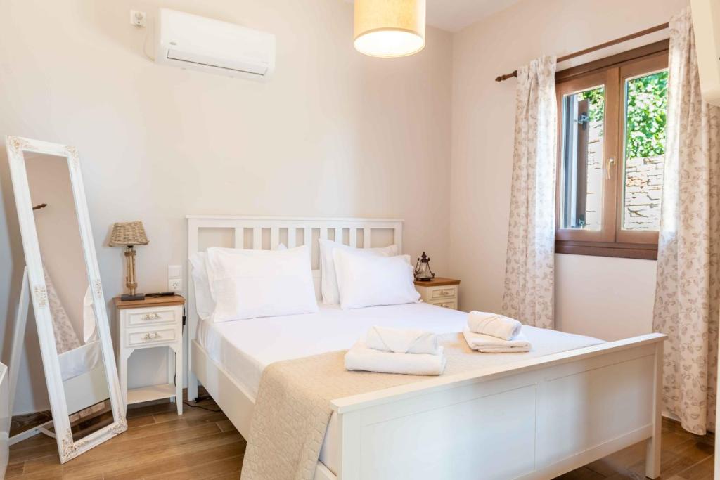 Posteľ alebo postele v izbe v ubytovaní Petrichor houses