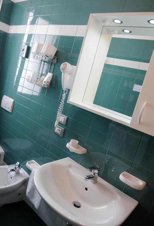 Koupelna v ubytování Hotel Raffaello