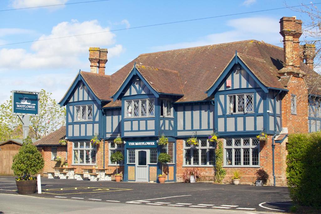 a large blue and white building in a street at The Mayflower in Lymington