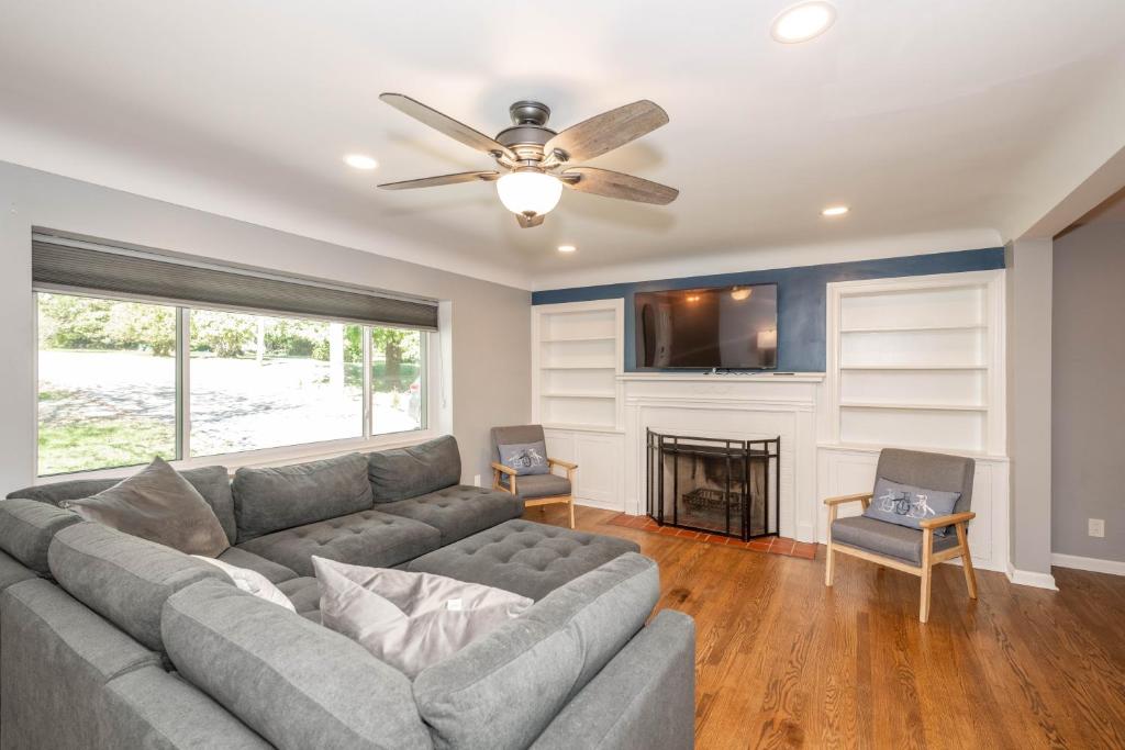 a living room with a couch and a fireplace at Love 'n Life Haven in Cincinnati