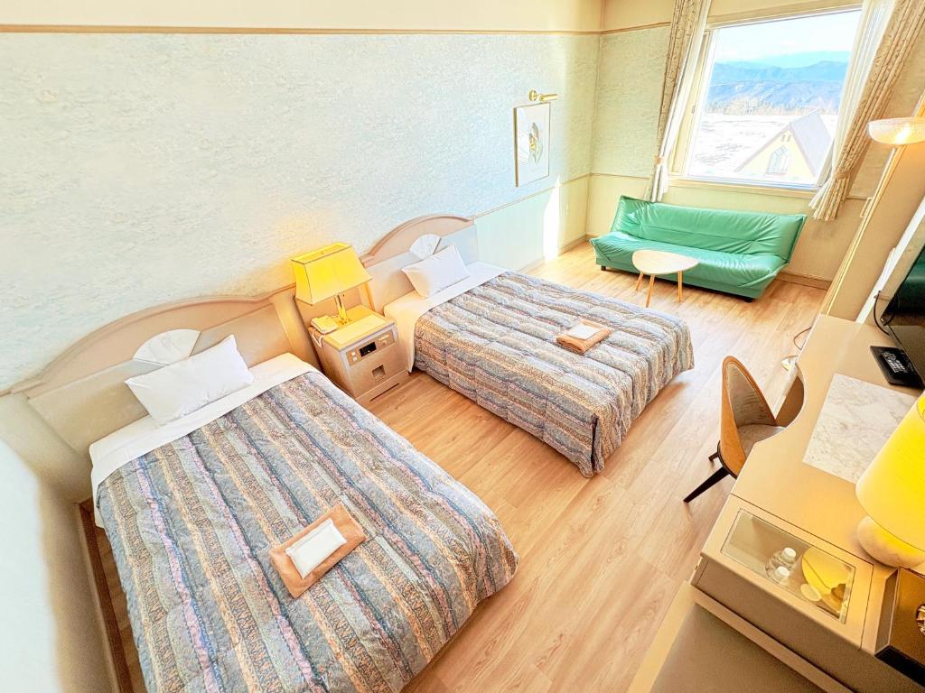 Postel nebo postele na pokoji v ubytování Palcall Tsumagoi Resort Ski & Hotel