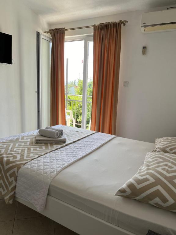 Postel nebo postele na pokoji v ubytování Apartmani Bekonja