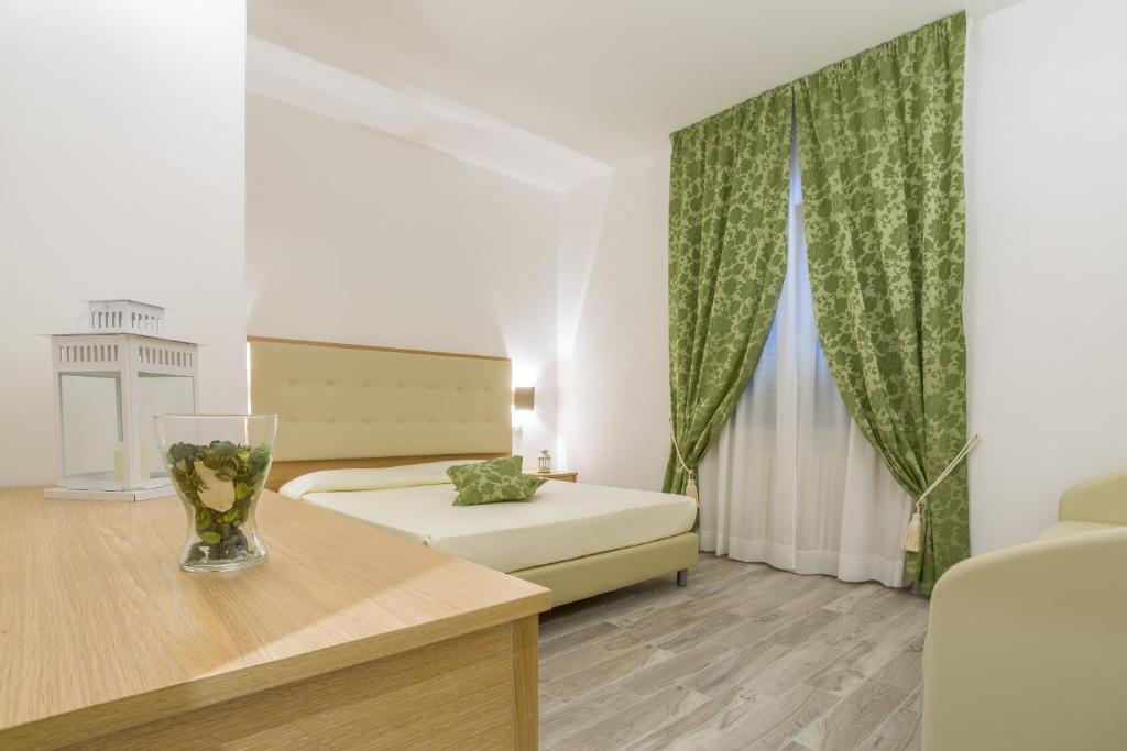 Postel nebo postele na pokoji v ubytování Hotel Il Buongustaio