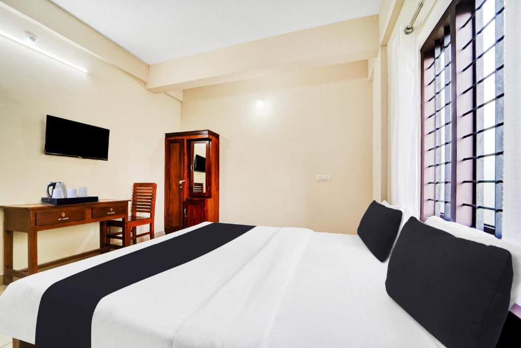 Postel nebo postele na pokoji v ubytování Super Hotel O Ambalamedu
