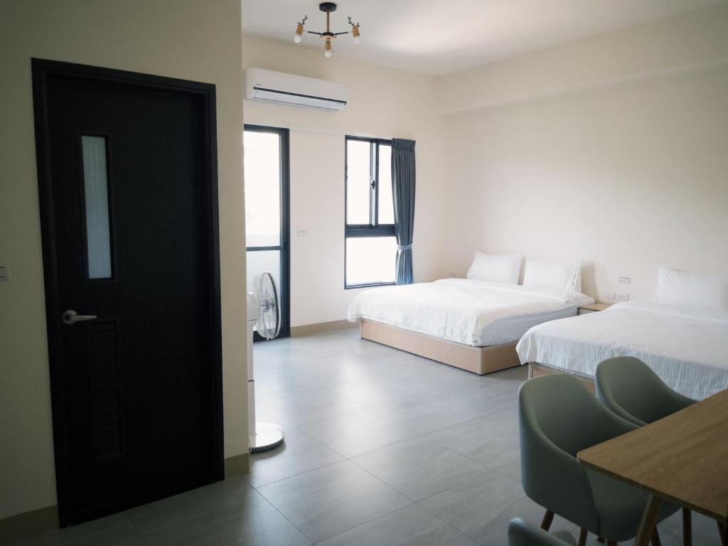 Postel nebo postele na pokoji v ubytování 瑞穗阿牛的家 Rui Sui Moo Guesthouse
